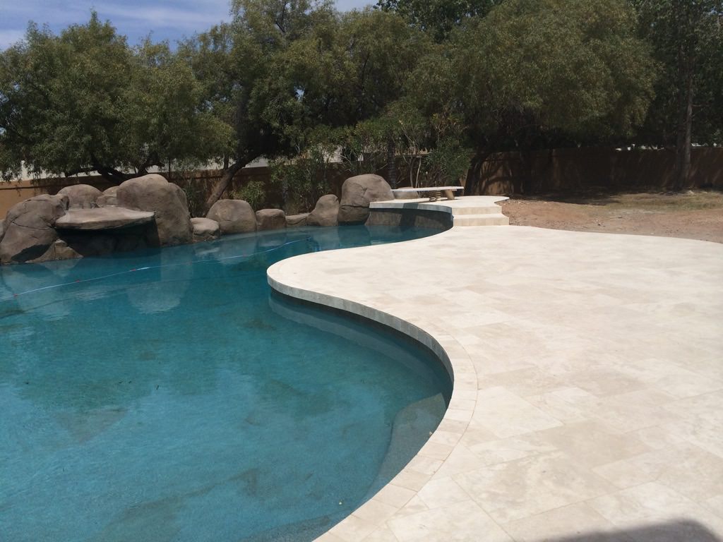 Upgrade your outdoor space with a luxurious patio installation by Aguilar Tile And Stone, serving Arizona homeowners.